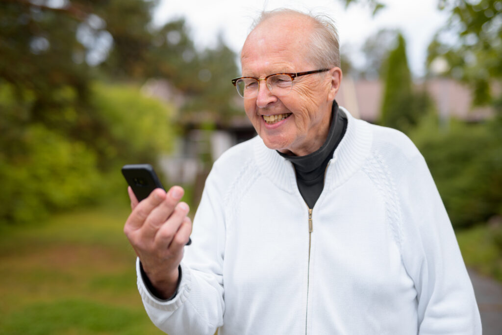 Portrait of senior man wearing eyeglasses at home outdoors